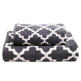 Two gray patterned towels on a white background
