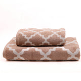 Two beige patterned towels on a white background