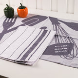 Two kitchen towel sets with utensil patterns on a white surface.