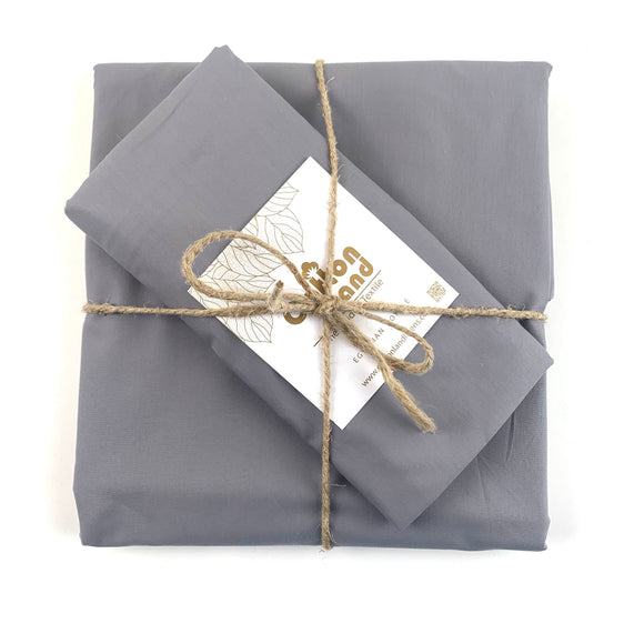 Gray folded bedsheets on a white background