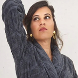 Woman wearing a gray bathrobe 